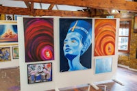 a room with paintings on the walls