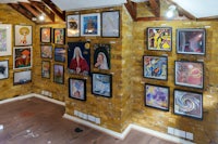 a room with a lot of art on the walls